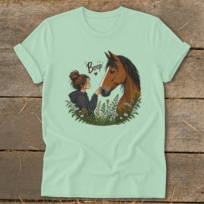 Illustration of a girl booping a horse's nose in a field of flowers.