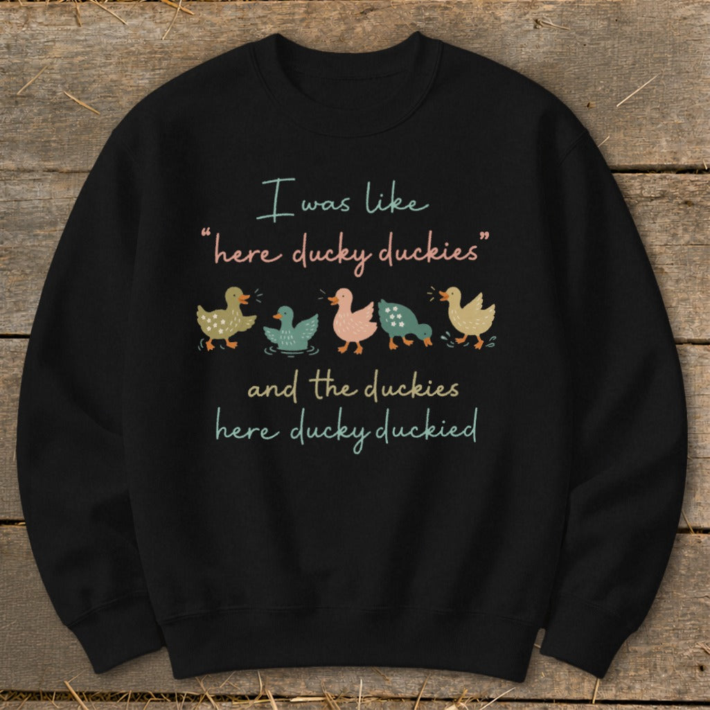 Black sweatshirt with ducks and text "I was like 'here ducky duckies' and the duckies here ducky duckied"