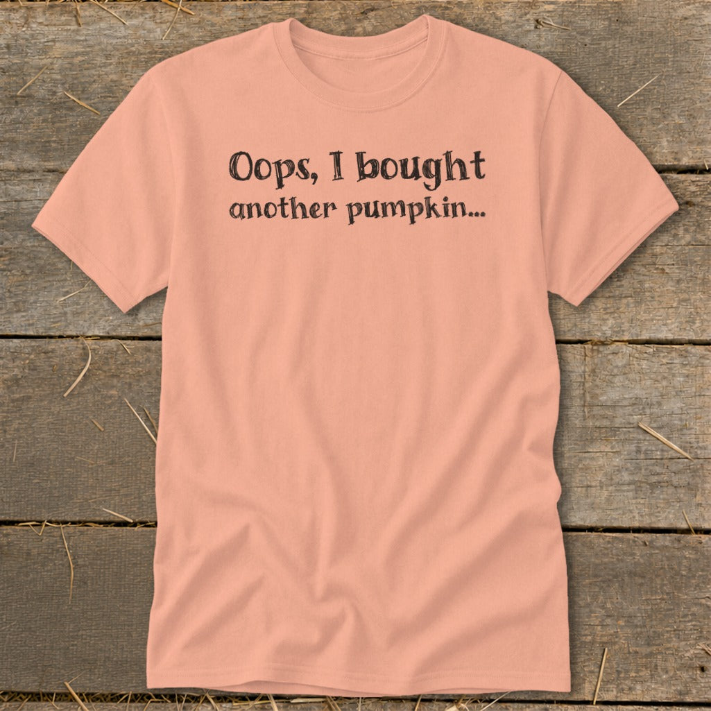 Peach t-shirt with black text "Oops, I bought another pumpkin..."