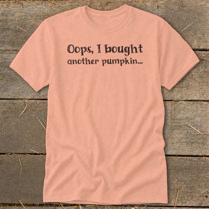 Peach t-shirt with black text "Oops, I bought another pumpkin..."