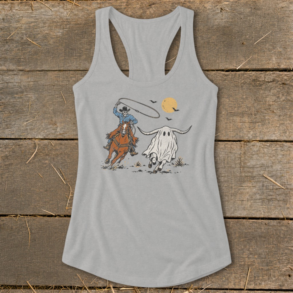 Skeleton cowboy on horse lassoing a ghost longhorn under a full moon.