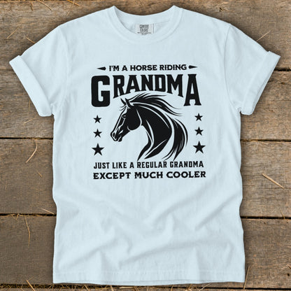 White t-shirt with black graphic "I'm a horse riding Grandma, just like a regular grandma except much cooler".