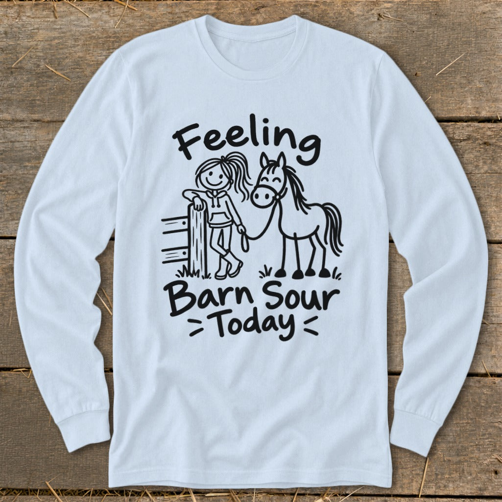 White long sleeve shirt with cartoon girl, horse, fence, and "Feeling Barn Sour Today" text.