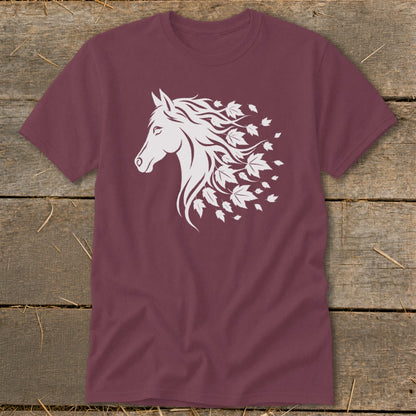 Maroon t-shirt with white horse head and flowing mane transforming into autumn leaves.