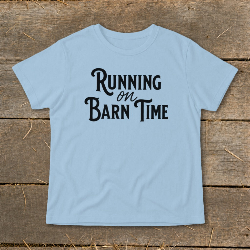 Light blue t-shirt with black text that reads "Running on Barn Time."