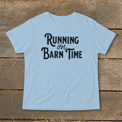 Light blue t-shirt with black text that reads "Running on Barn Time."