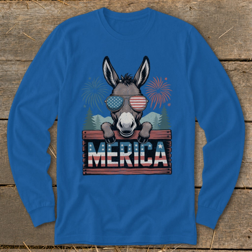 Donkey wearing American flag sunglasses over "MERICA" sign with fireworks and trees.