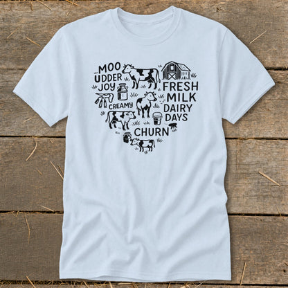 Light blue t-shirt with heart graphic of cows, barn, and dairy farm words.
