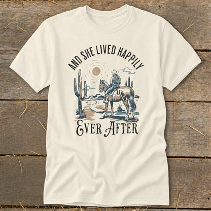 T-shirt with cowboy graphic and text "And She Lived Happily Ever After".