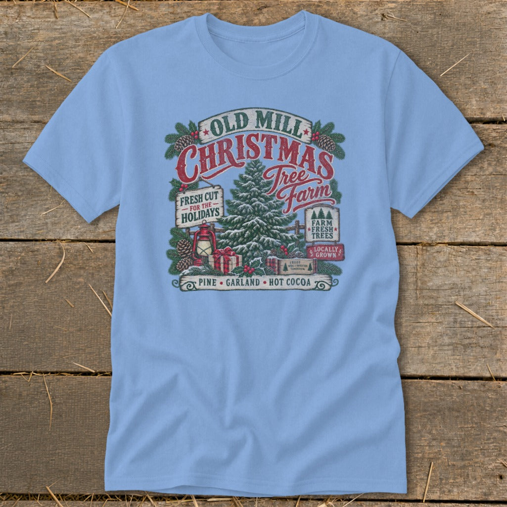 Light blue t-shirt with Old Mill Christmas Tree Farm graphic featuring a tree, gifts, and text.