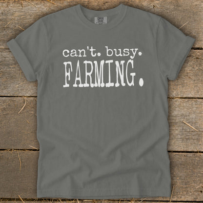 Gray t-shirt with white text: "can't. busy. FARMING."