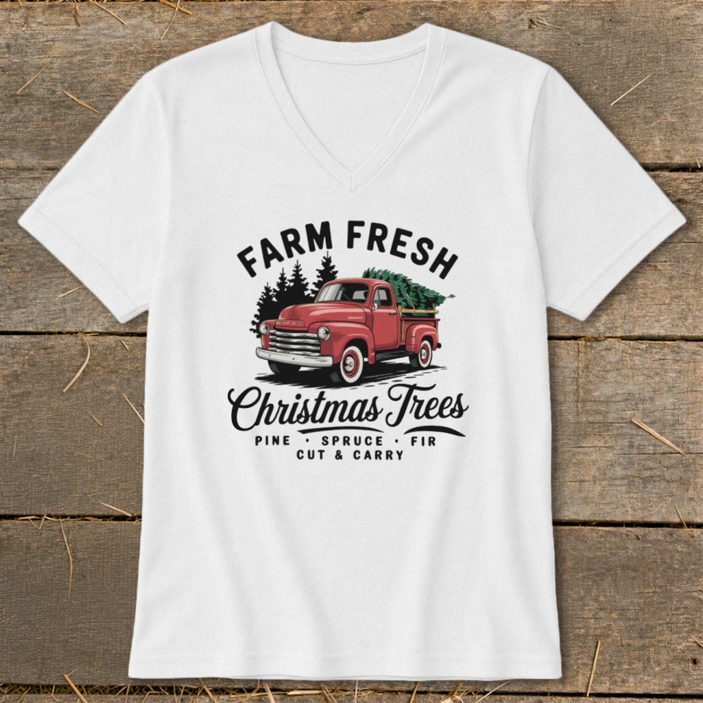 White t-shirt with vintage red truck hauling Christmas trees and text "Farm Fresh Christmas Trees".