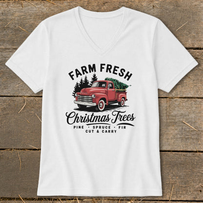 White t-shirt with vintage red truck hauling Christmas trees and text "Farm Fresh Christmas Trees".