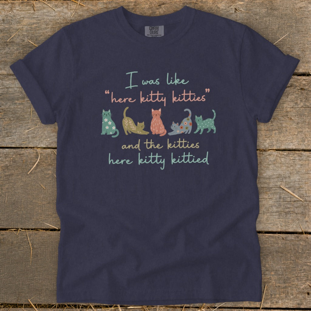 Navy t-shirt with "I was like 'here kitty kitties' and the kitties here kitty kittied" and cats.