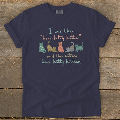 Navy t-shirt with "I was like 'here kitty kitties' and the kitties here kitty kittied" and cats.