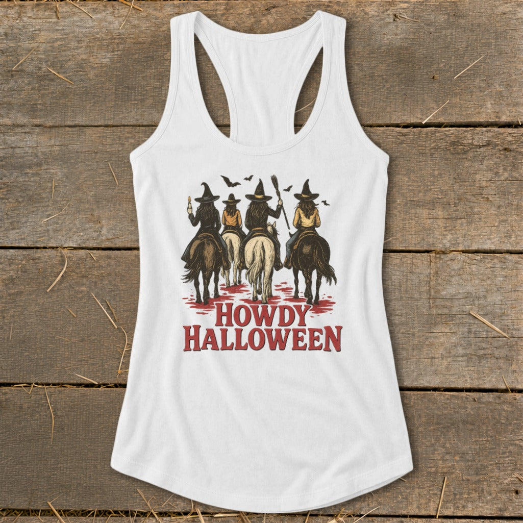White tank top with four women in witch hats riding horses and text HOWDY HALLOWEEN.