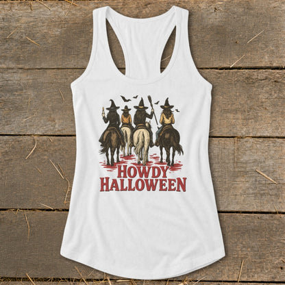 White tank top with four women in witch hats riding horses and text HOWDY HALLOWEEN.