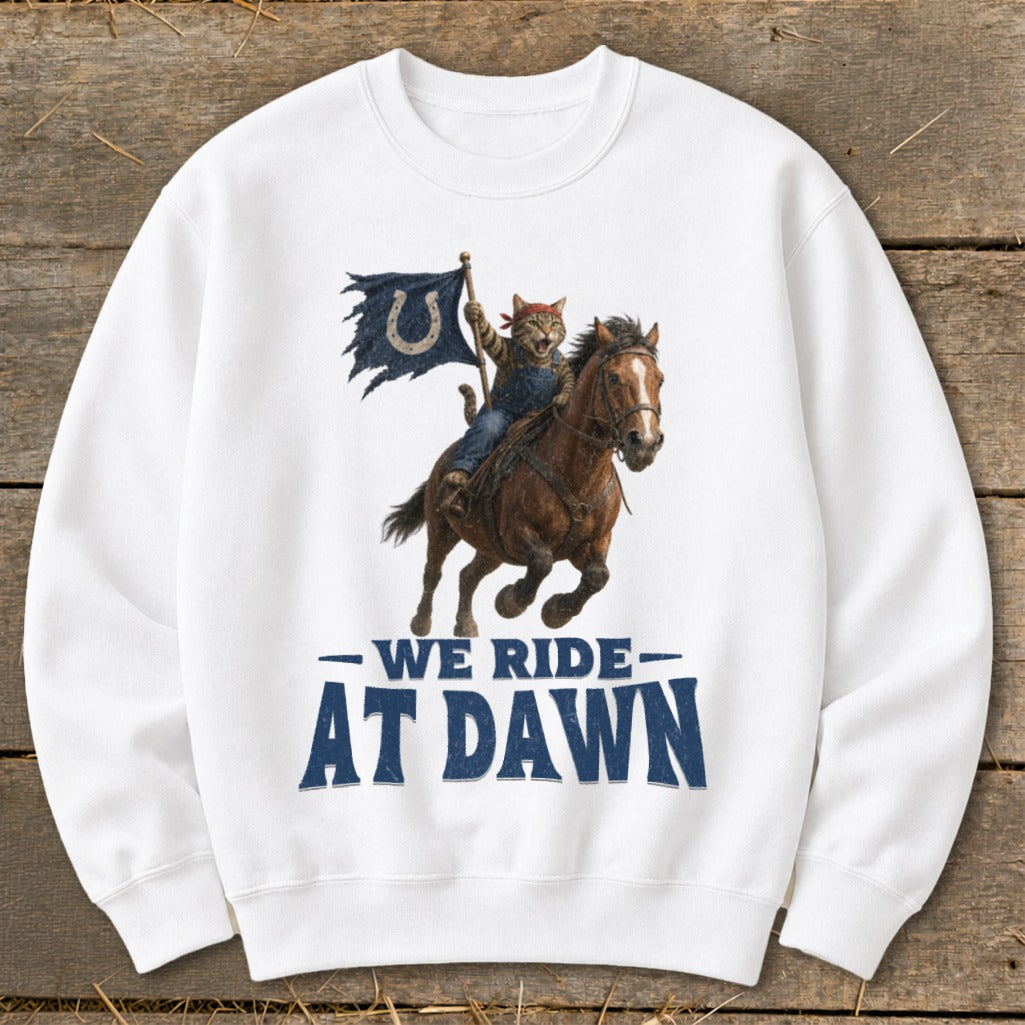Cat riding a horse with a horseshoe flag and text "We Ride At Dawn".