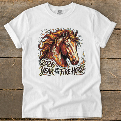 White t-shirt with a graphic of a horse with flames and text "2026 Year of the Fire Horse".