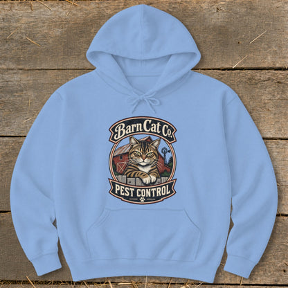 A light blue hooded sweatshirt features a vintage graphic of a tabby cat resting on a fence in front of a red barn, with text that reads "Barn Cat Co. Pest Control."