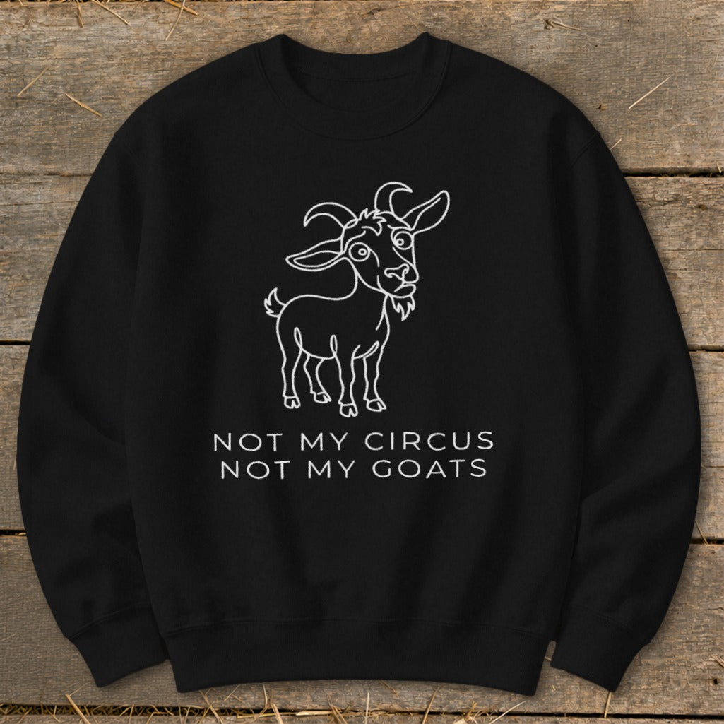 Black sweatshirt with a white outline drawing of a goat and the text "NOT MY CIRCUS NOT MY GOATS".