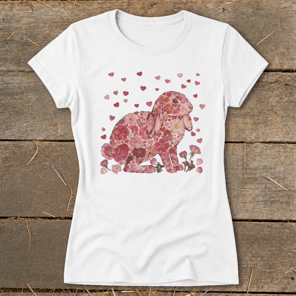 White t-shirt with a pink floral bunny design and scattered red hearts.