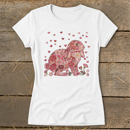 White t-shirt with a pink floral bunny design and scattered red hearts.