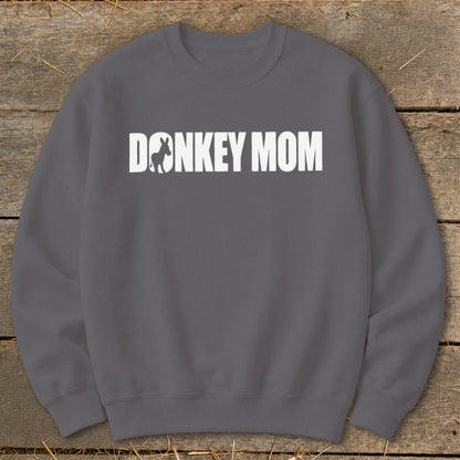 Dark grey crewneck sweatshirt featuring white text that reads DONKEY MOM with a donkey silhouette.