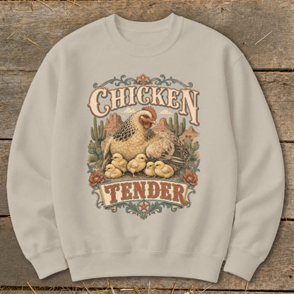 Chicken Tender graphic on a light beige sweatshirt with a hen and chicks in a desert landscape.