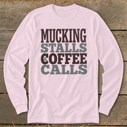 Pink long-sleeve shirt with "Mucking Stalls Coffee Calls" text design.