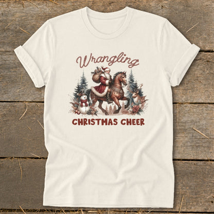 Santa on horseback with a snowman and deer, text "Wrangling Christmas Cheer."