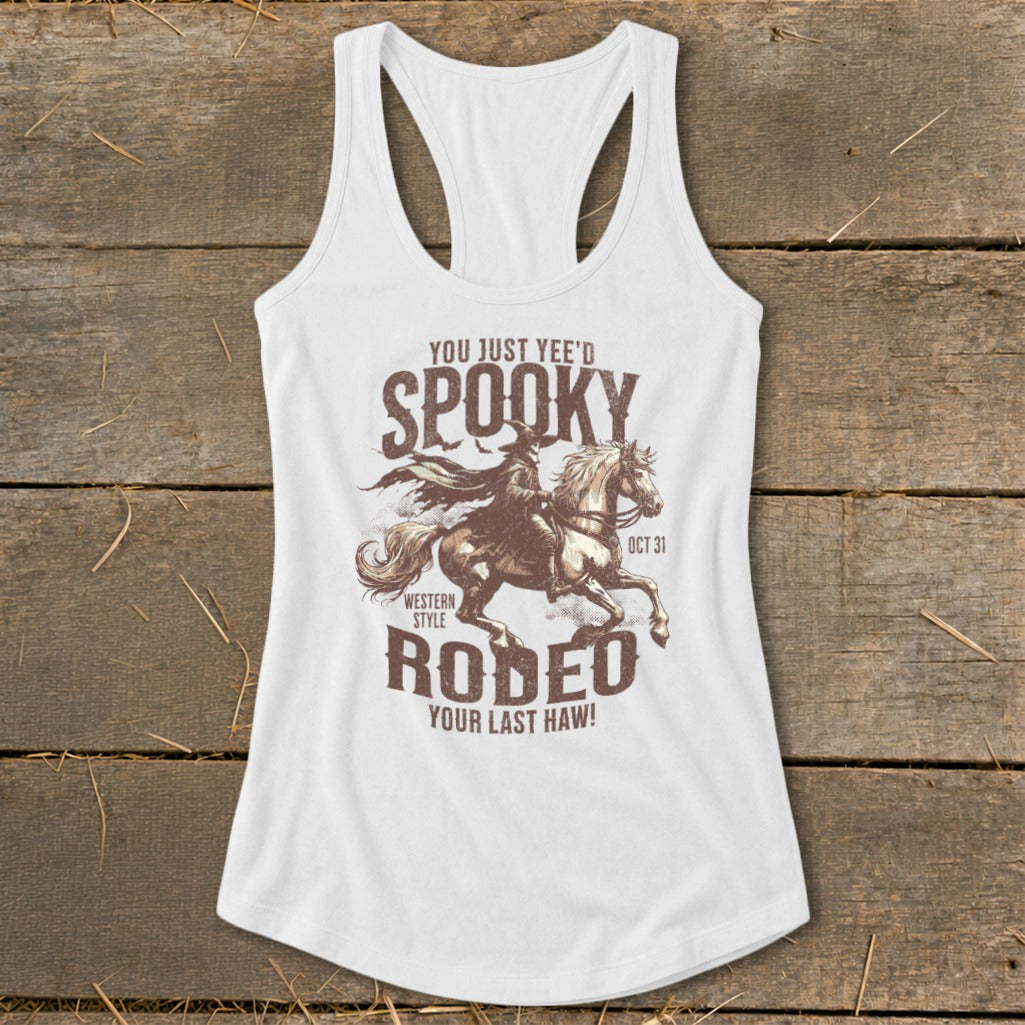 White tank top with "Spooky Rodeo" graphic featuring a cowboy on a horse and text.