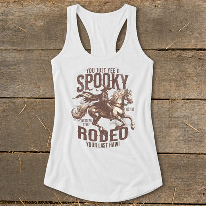 White tank top with "Spooky Rodeo" graphic featuring a cowboy on a horse and text.