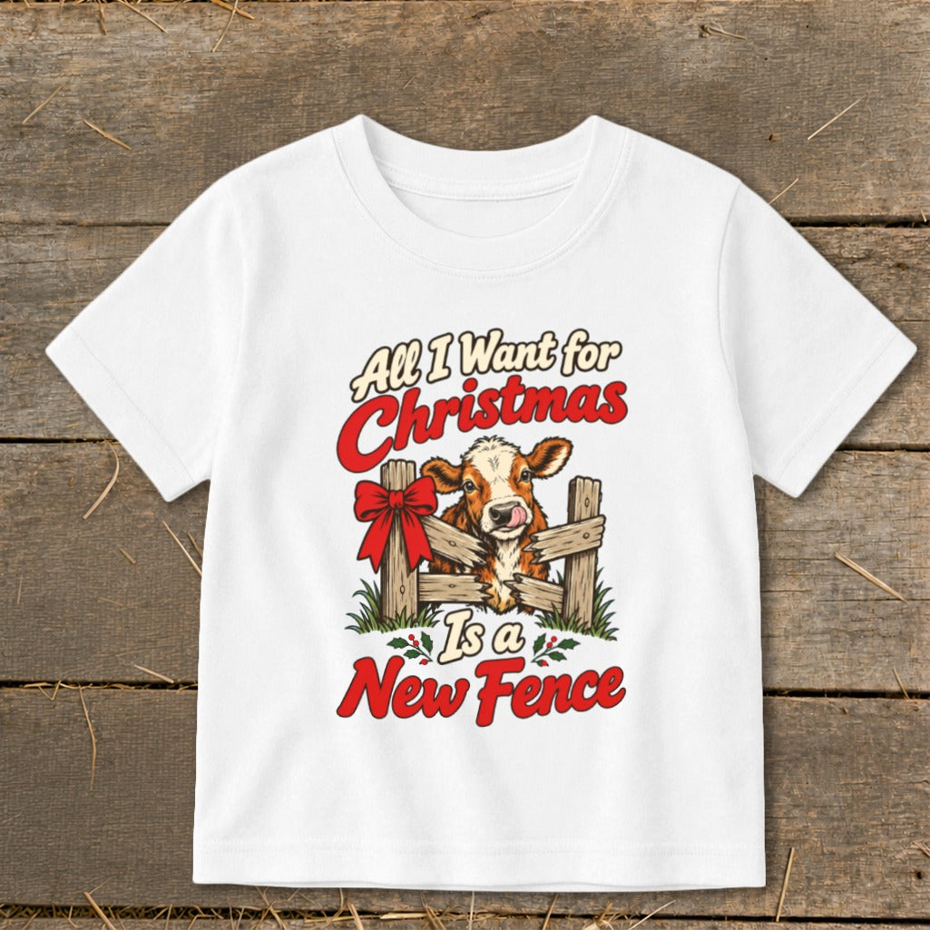 White t-shirt with text "All I Want for Christmas Is a New Fence" and a cow graphic.