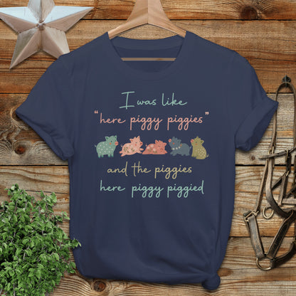 Navy t-shirt with piggies saying "here piggy piggies and the piggies here piggy piggied".