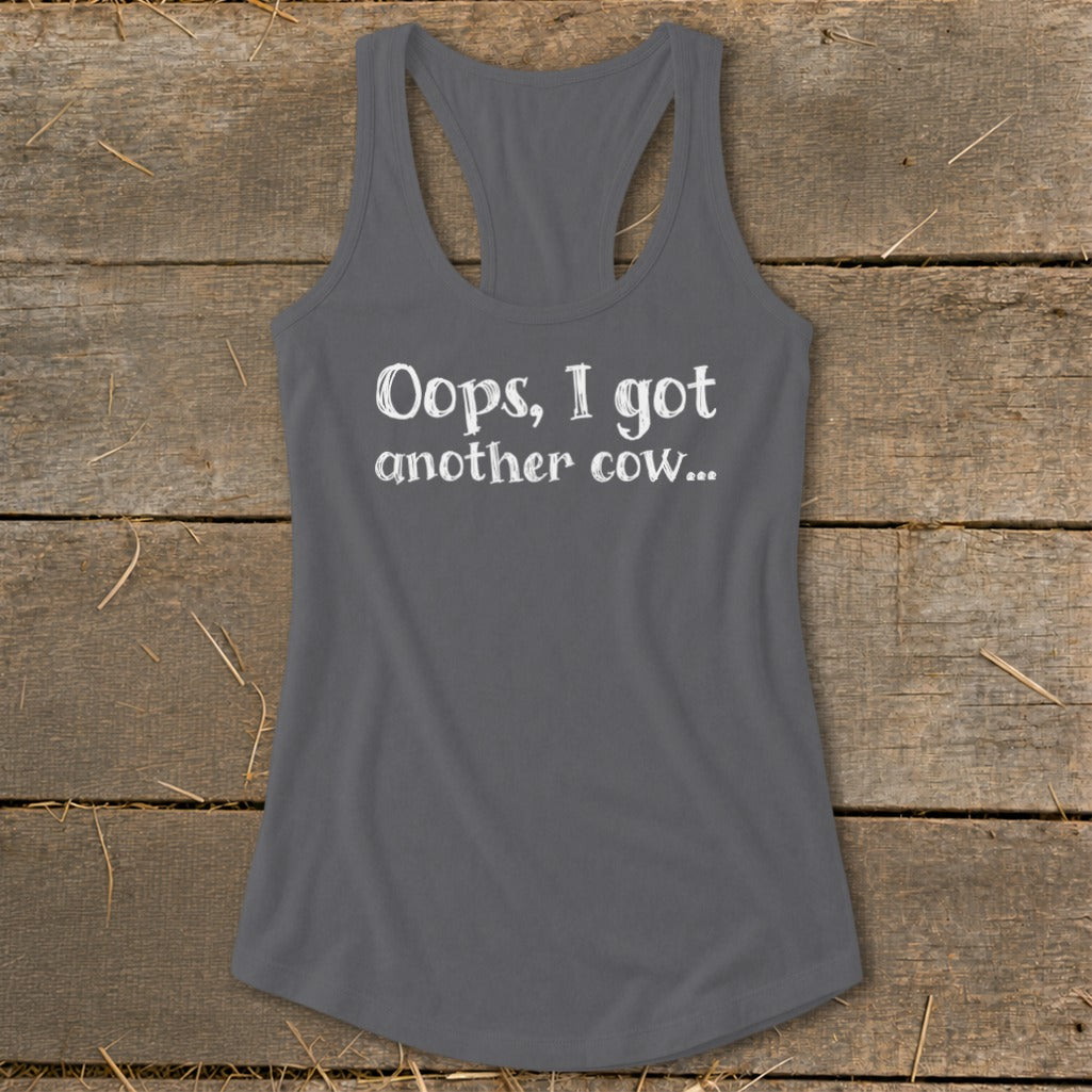 Gray racerback tank top with white text: "Oops, I got another cow..."