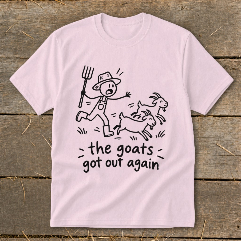 Pink t-shirt with a cartoon of a farmer chasing goats and text "the goats got out again".