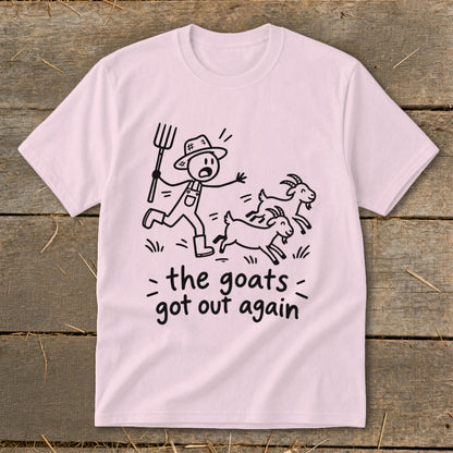 Pink t-shirt with a cartoon of a farmer chasing goats and text "the goats got out again".