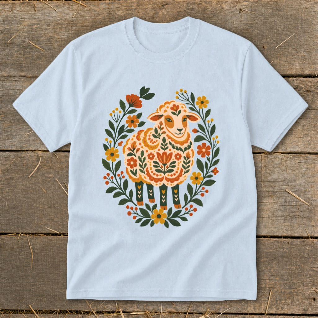 Light blue t-shirt with a floral folk art sheep design.