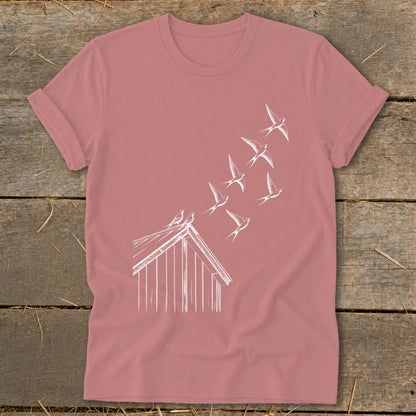 Mauve crewneck t-shirt featuring a white line drawing of birds flying from a small wooden coop.