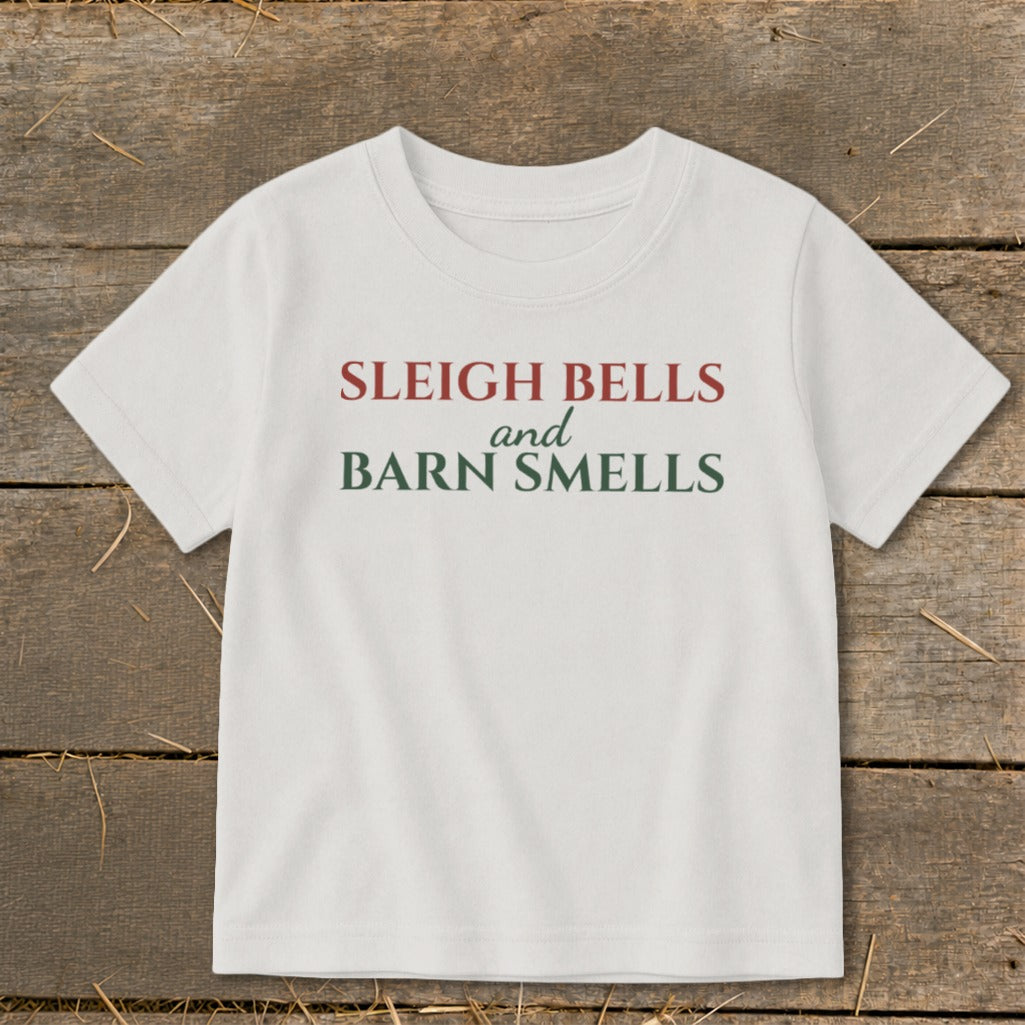 White t-shirt with text "SLEIGH BELLS and BARN SMELLS".