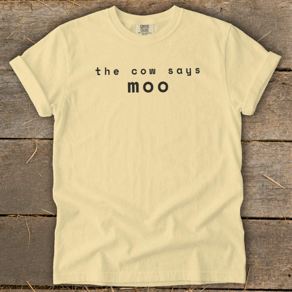 Yellow t-shirt with black text "the cow says moo".