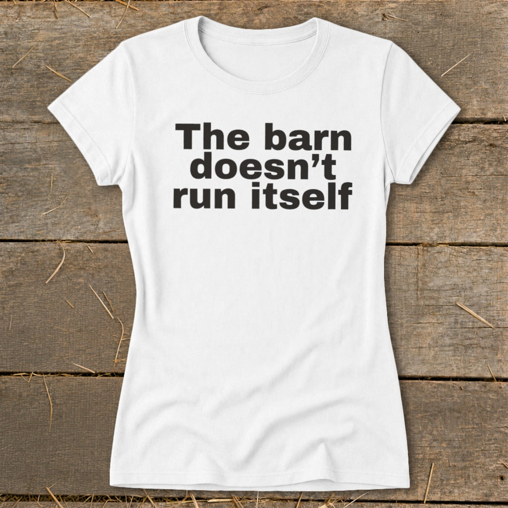 White t-shirt with black text reading "The barn doesn't run itself".
