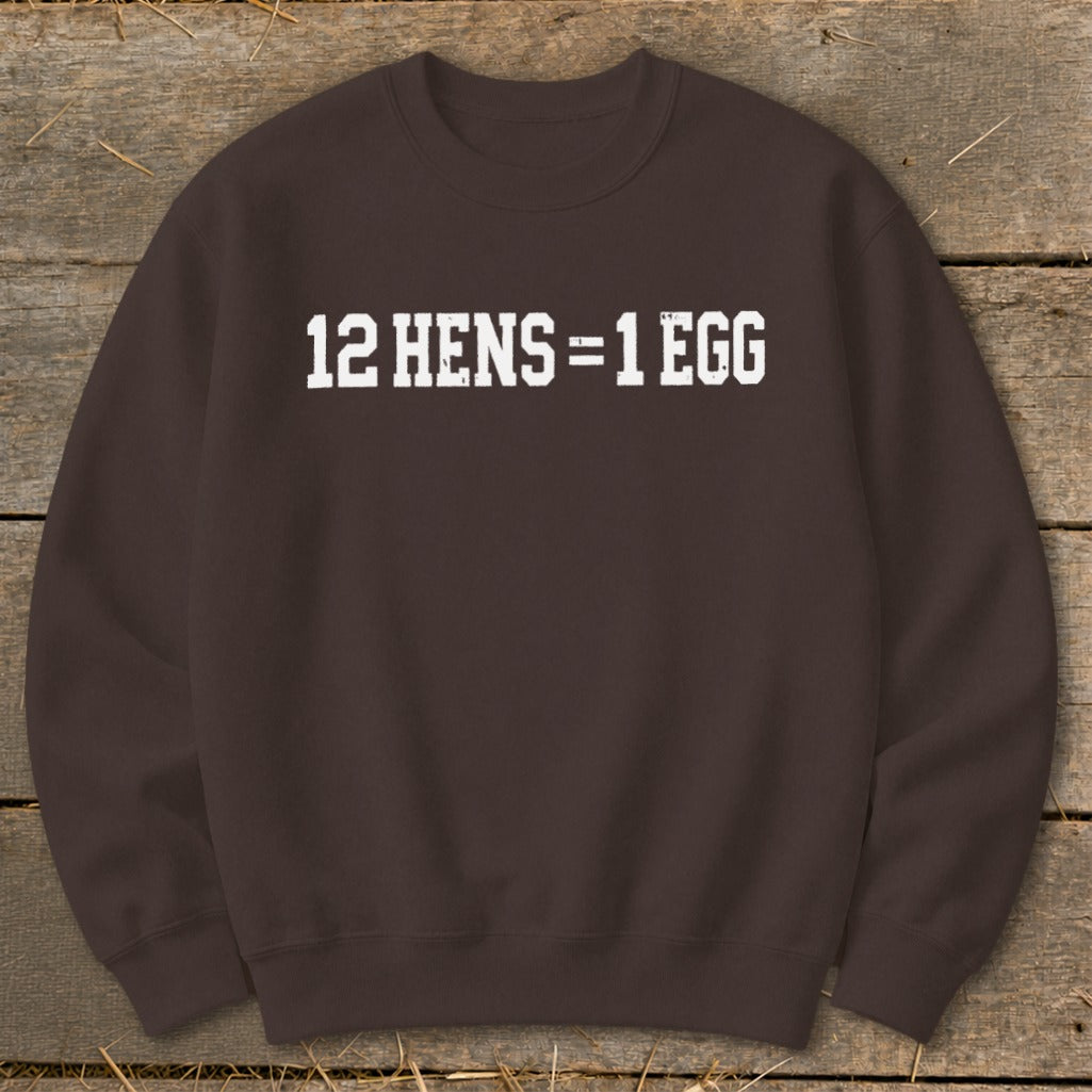 A brown crewneck sweatshirt featuring the white distressed text "12 HENS = 1 EGG" centered on the chest.