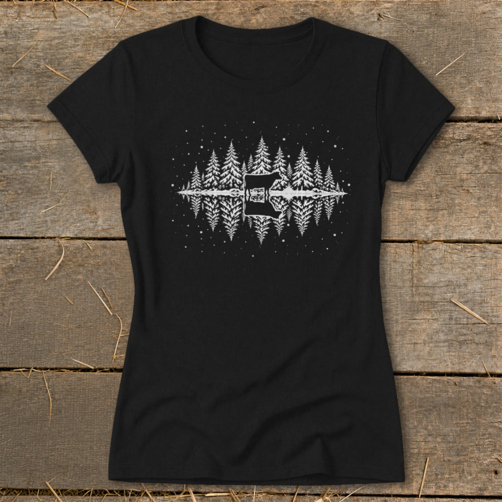 Black t-shirt with white graphic of a cow, pine trees, and stars reflected in water.