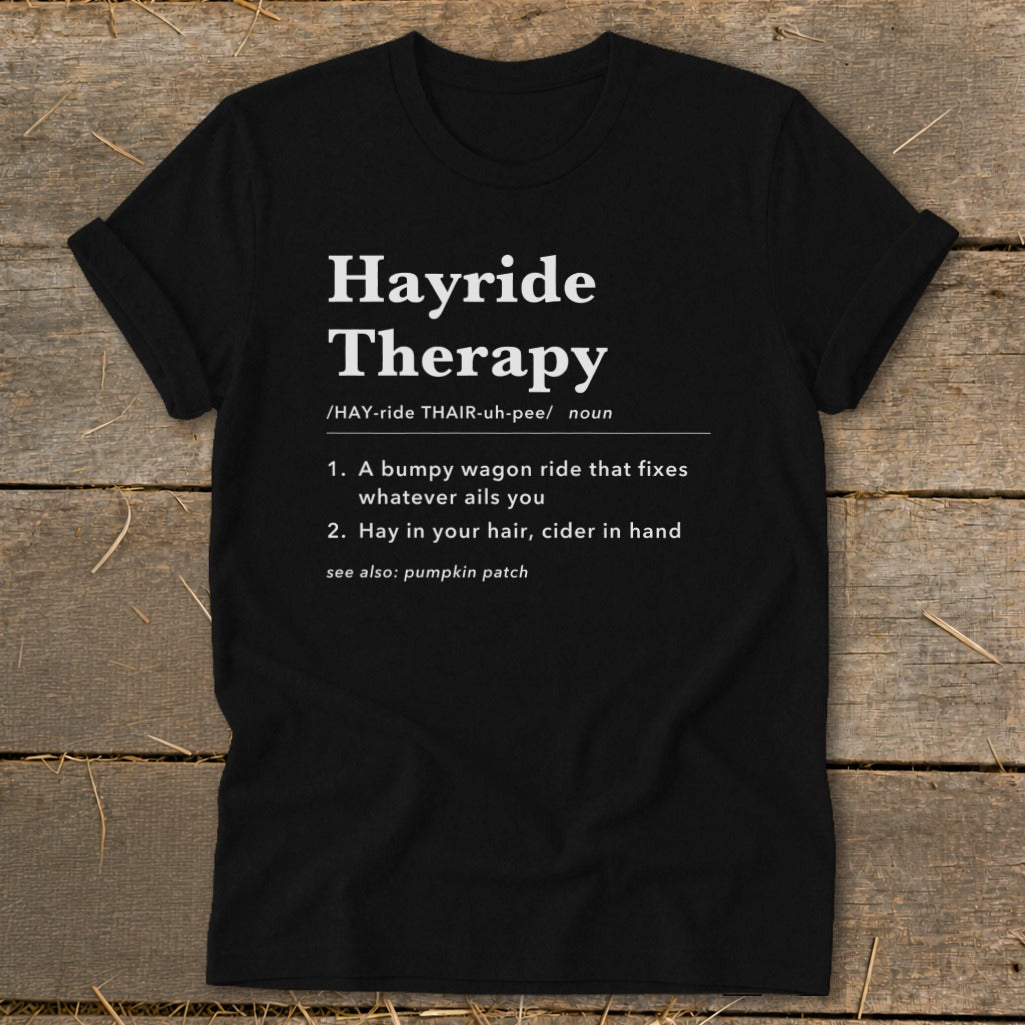 Black t-shirt with "Hayride Therapy" definition: bumpy wagon ride, hay in hair, cider in hand.