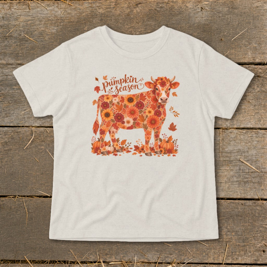 Cow adorned with fall flowers and leaves, with "pumpkin season" text.