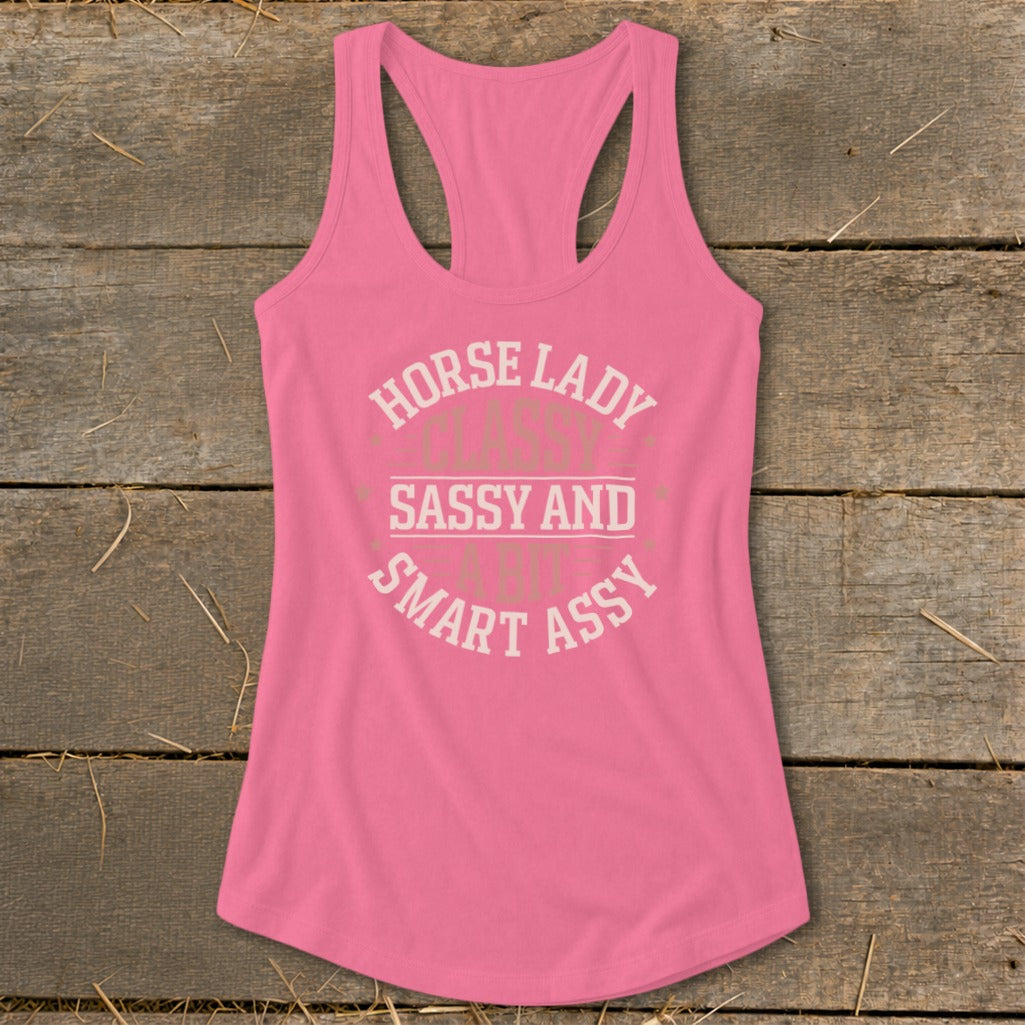 Pink racerback tank top with "Horse Lady Sassy and Smart Ass" text.