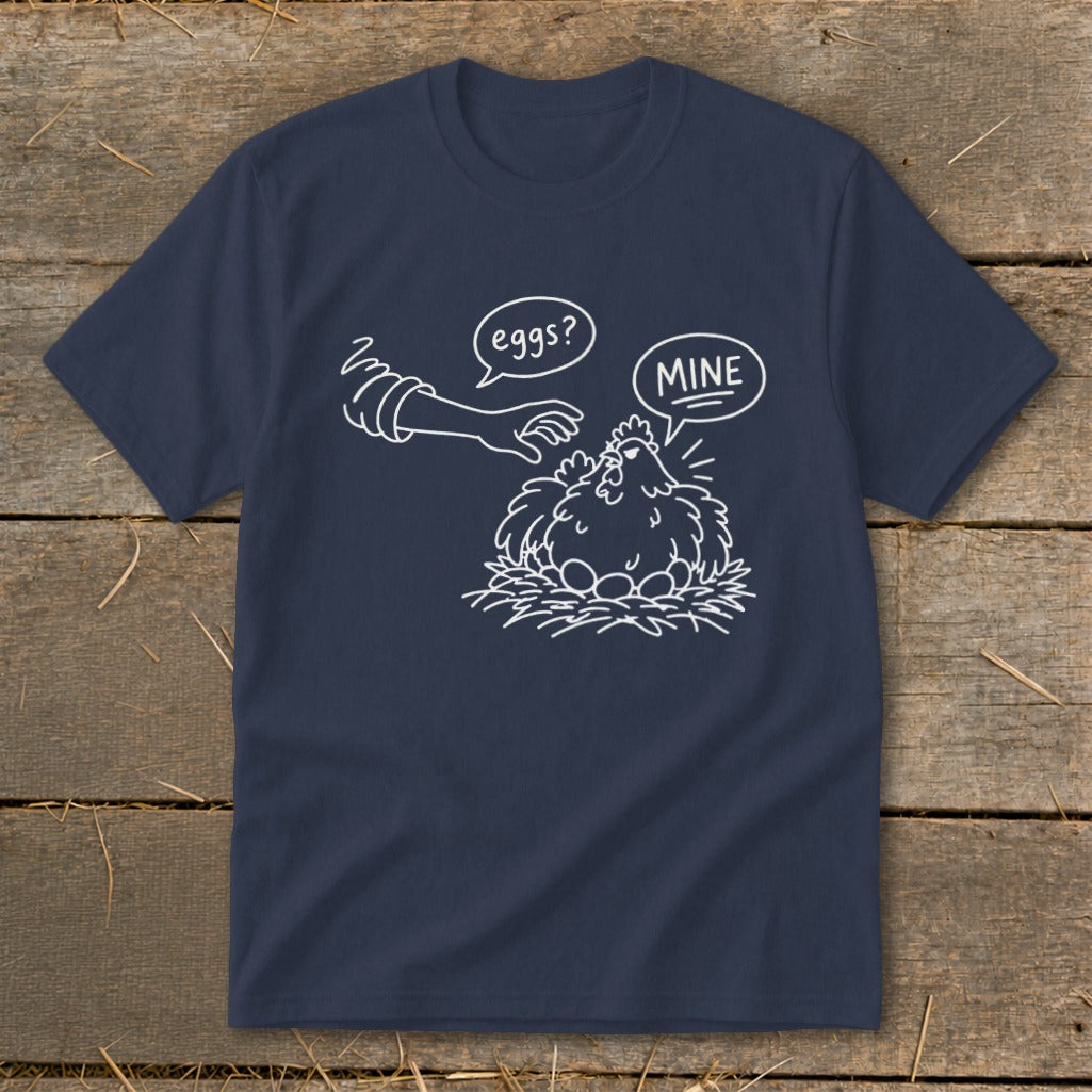 Navy t-shirt with a cartoon of a chicken guarding eggs and a hand reaching for them.
