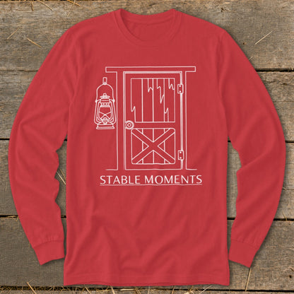 Red long-sleeved shirt with a white line drawing of a barn door and lantern.